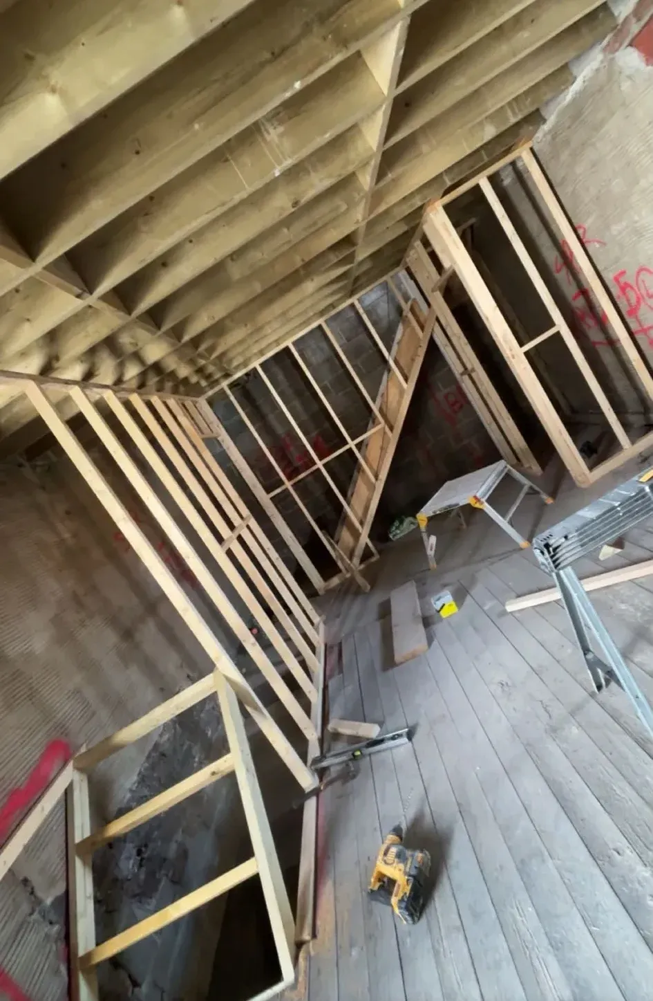 Timber studwork framed under the rafters