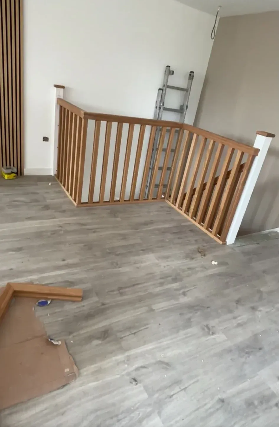 New balustrade and laid floor on a landing